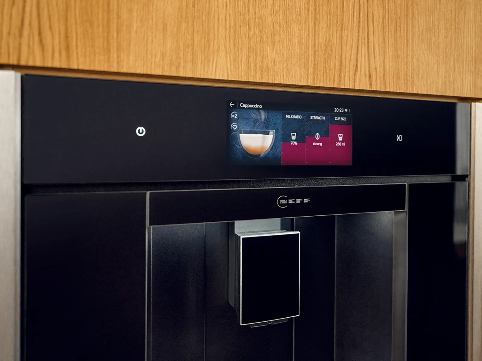 Built-in Neff coffee machine with digital display, integrated into wooden kitchen cabinetry.