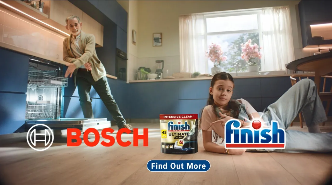 In a kitchen ad for Bosch and Finish, a man gestures towards an open Bosch dishwasher while a girl on the floor points to a box of Finish dishwasher tablets.