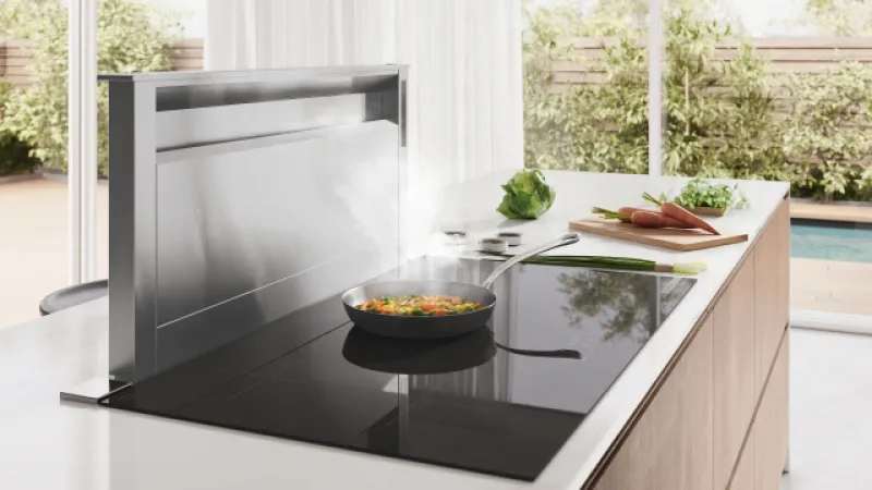 Stainless steel kitchen range hood with digital display and control panel.