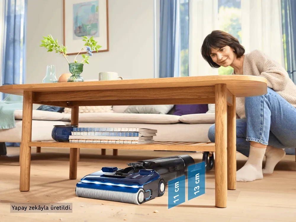 A woman uses the Bosch Floor Washer to easily reach under furniture and clean hard-to-reach spots.