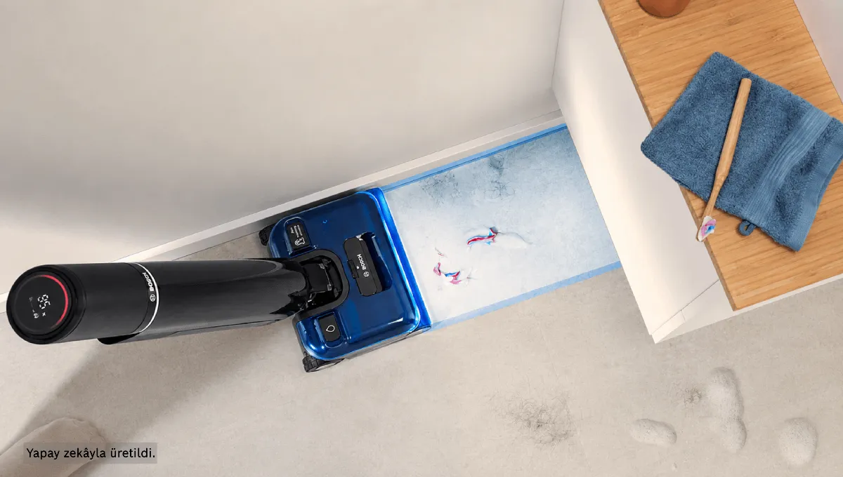 cleaning_1200x680.png Top-down view of the Bosch floor washer cleaning dirt and spills right up to the edge of a wall and white cabinet.