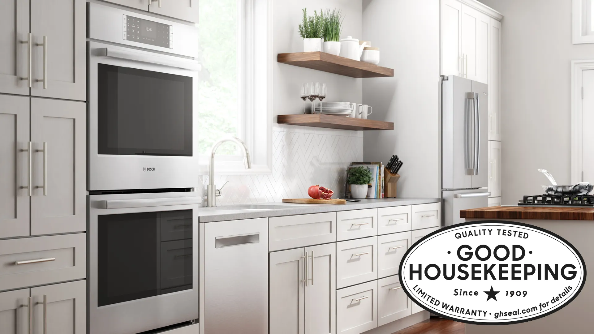Modern kitchen with Bosch double oven, white cabinets, and Good Housekeeping quality seal.