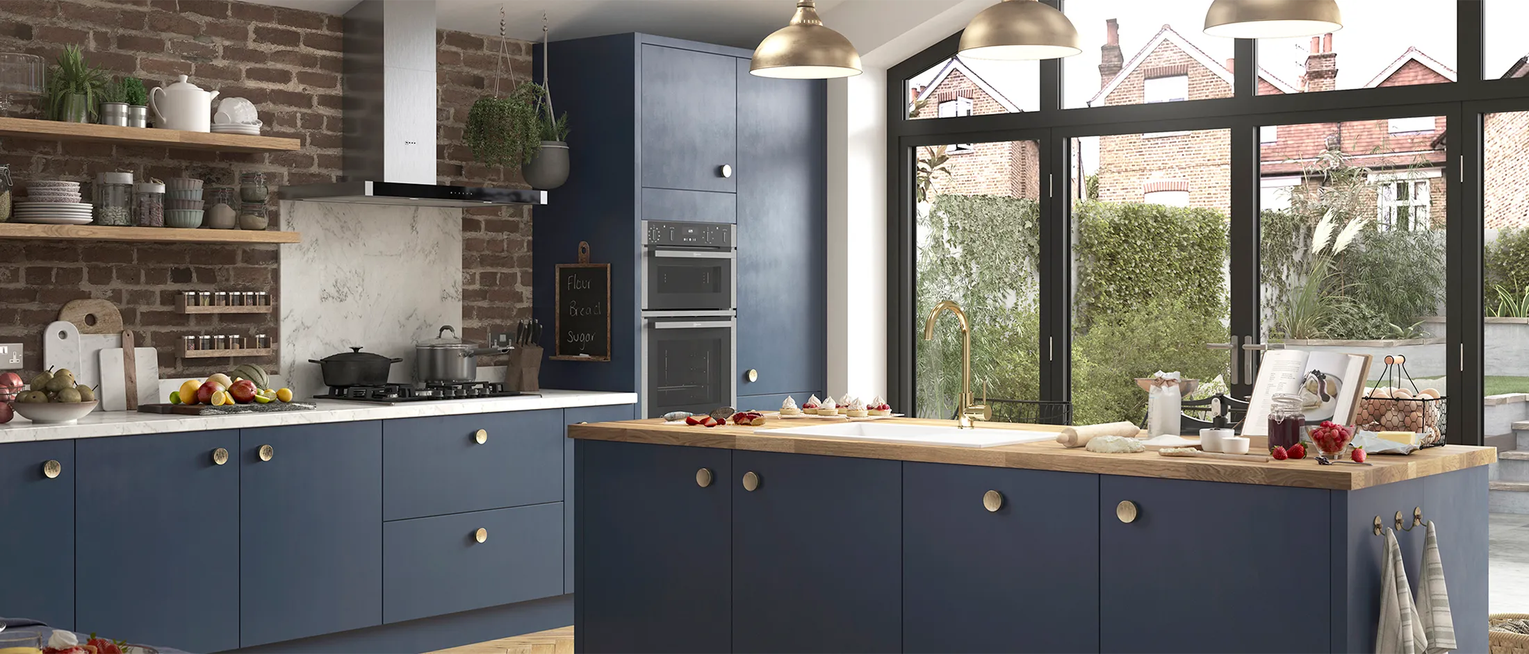 A wide, bright shot of a complete kitchen featuring blue cabinets, a large wooden-topped island, exposed brick, and large glass doors opening to a garden, with various NEFF appliances integrated throughout.