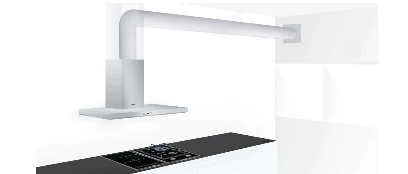 Modern kitchen with white overhead lamp and black gas stove top.