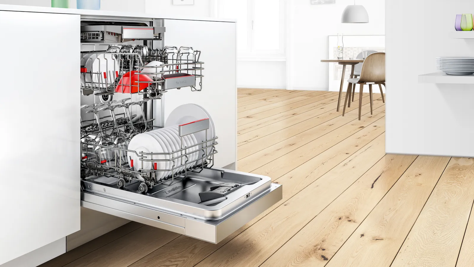 Open dishwasher with clean dishes inside, modern kitchen interior with wooden floor.