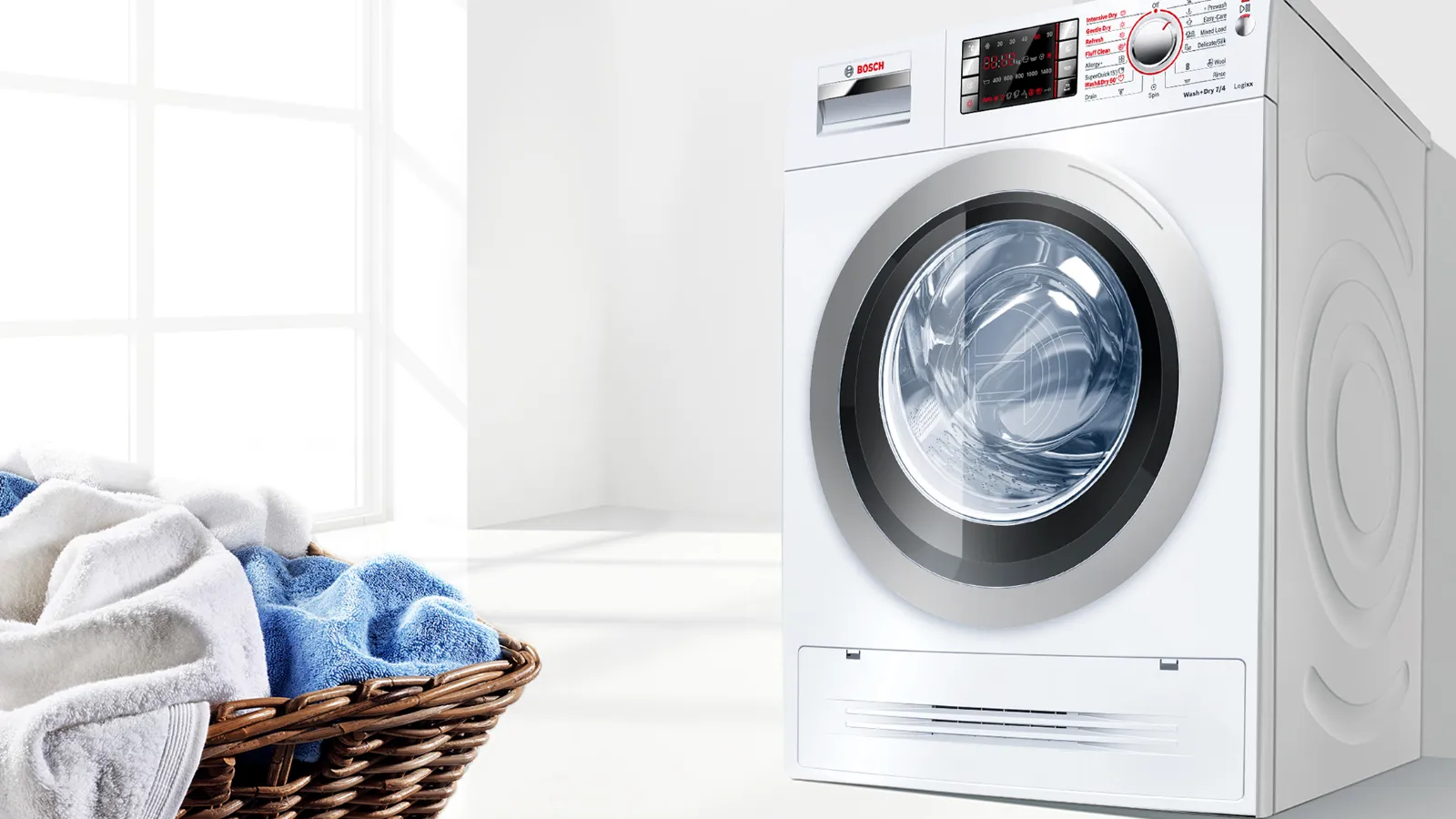 Washing machine, laundry basket, clean towels, bright room, modern appliance.