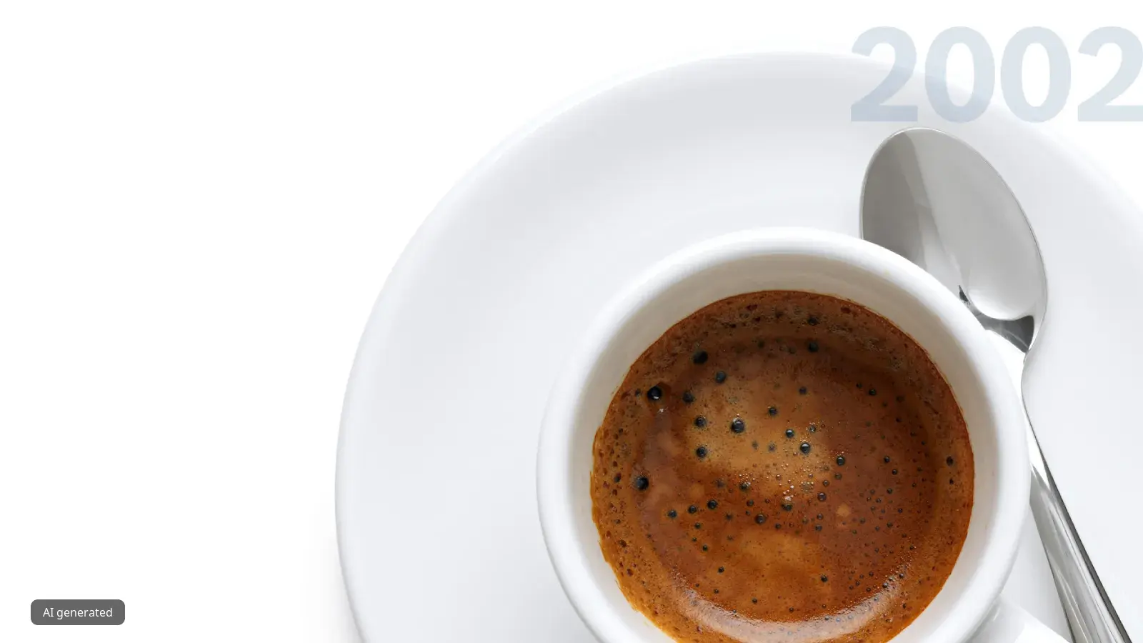 Espresso coffee cup with spoon on white background, with the year 2002 in the background.