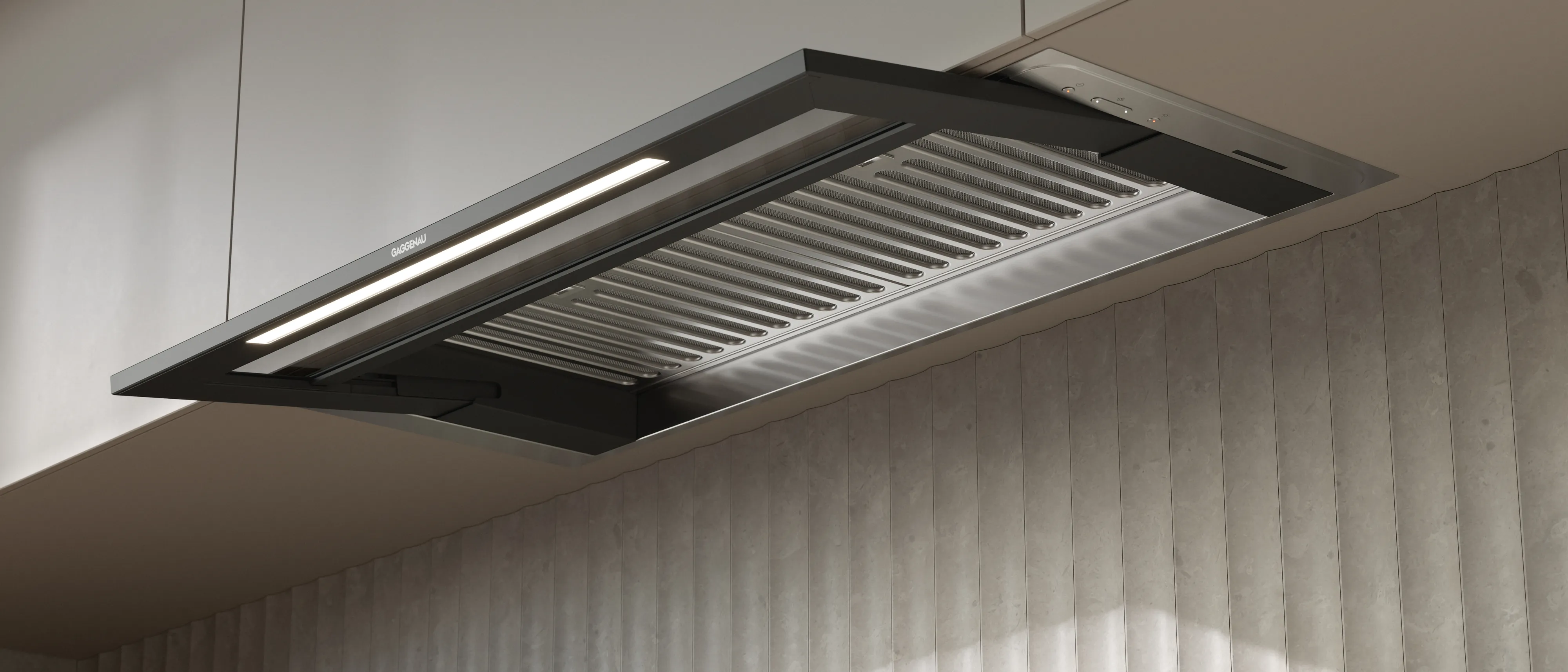 A Gaggenau telescopic hood in a bright luxury kitchen shown from below