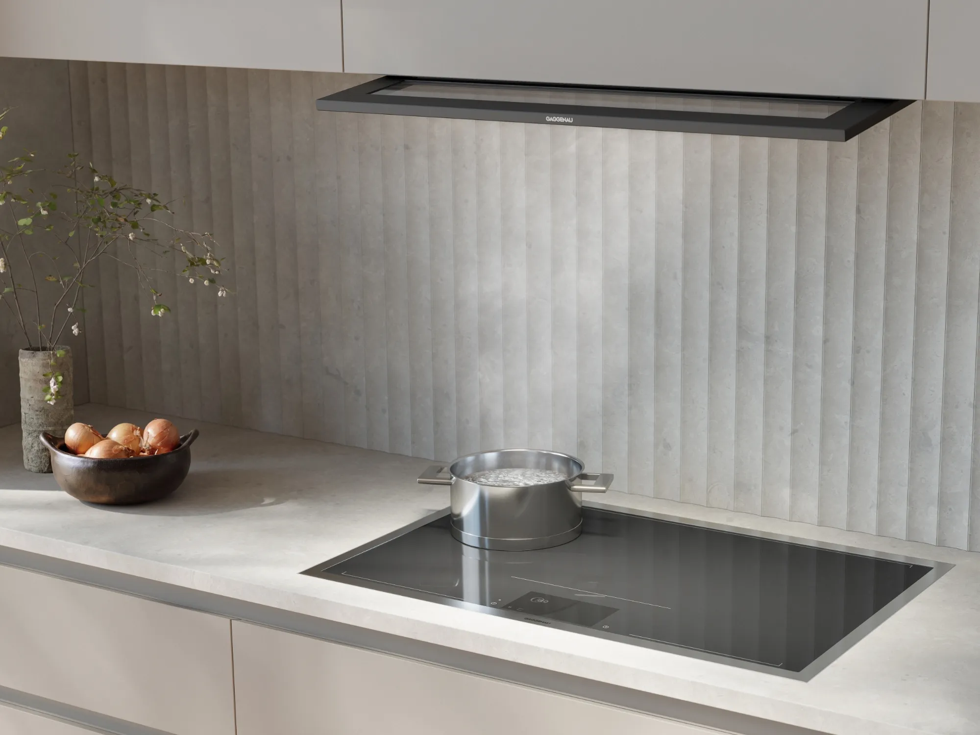 A Gaggenau telescopic hood in a bright luxury kitchen