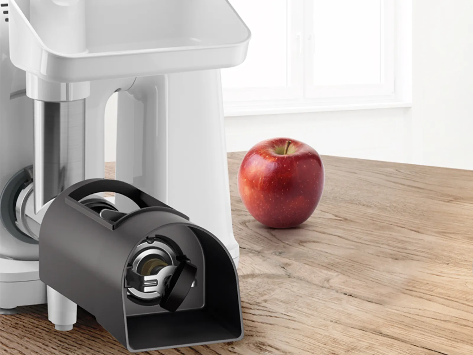 Kitchen appliance, electric grinder, red apple, wooden table, kitchen interior.