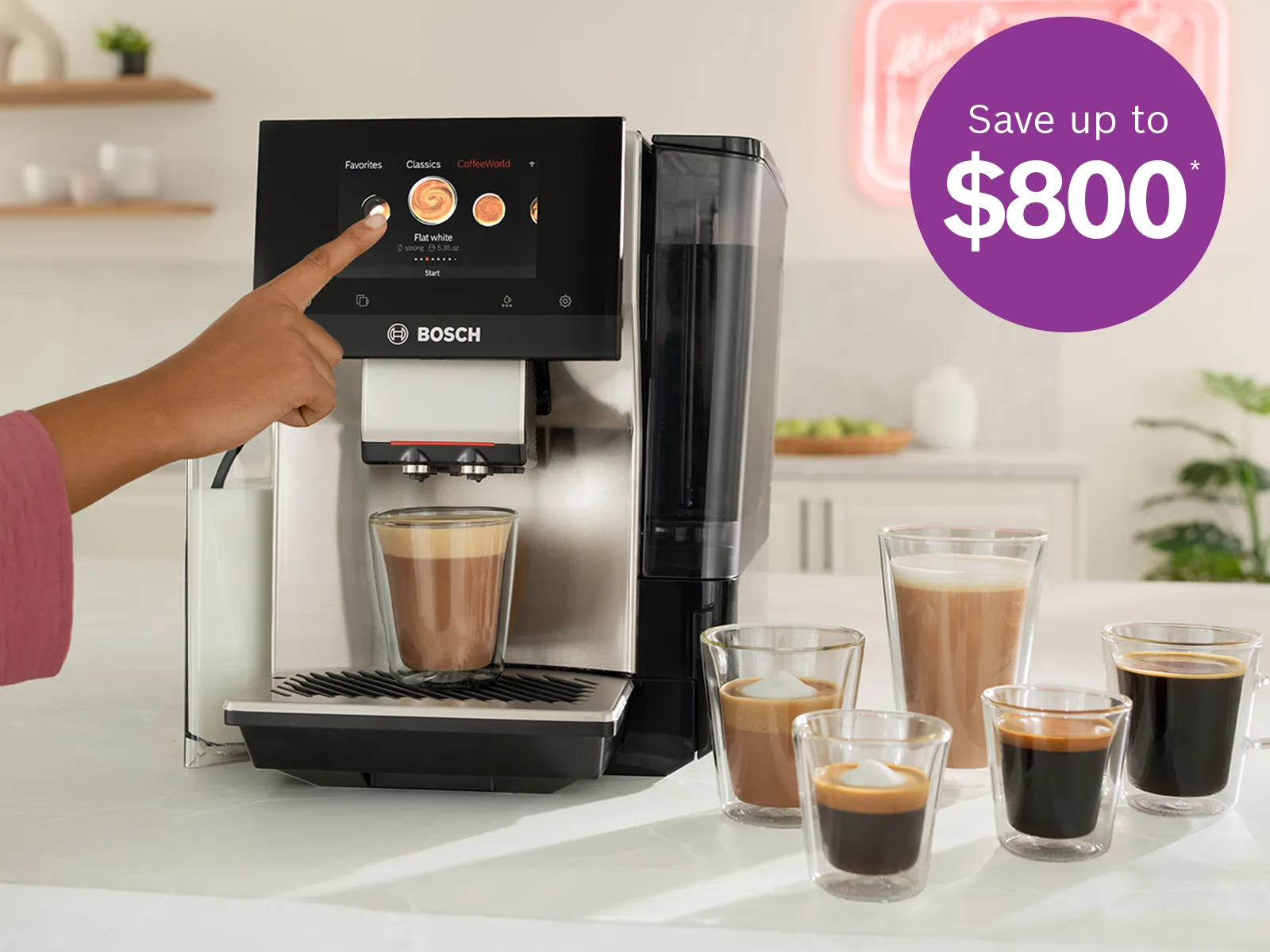 Person selecting a coffee option on a Bosch espresso machine, with freshly brewed coffees in glass cups and an “OPEN” neon sign.