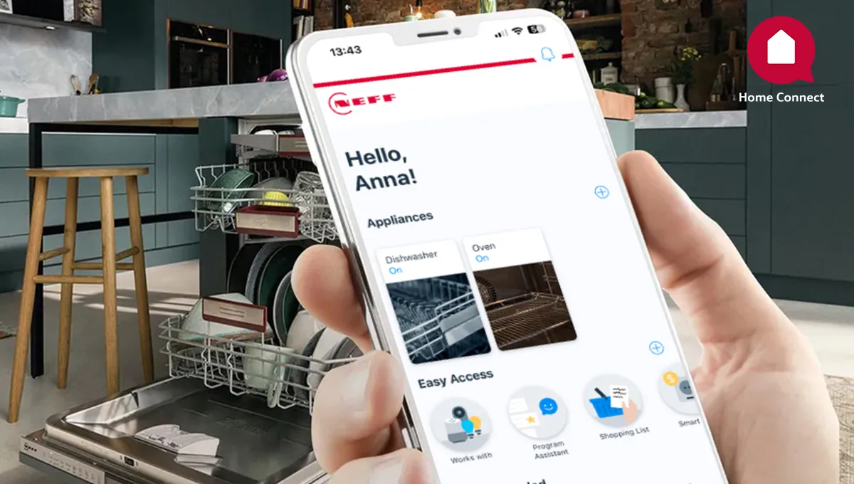 Smartphone displaying smart home app interface, dishwasher in kitchen background.