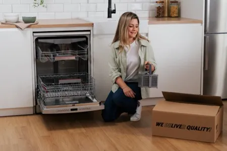 alt-Various Bosch kitchen accessories in a white kitchen.