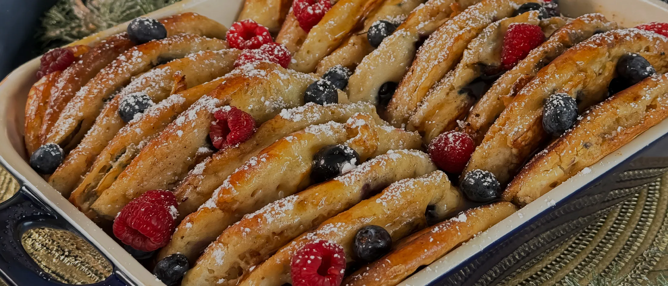 Blueberry Pancake Casserole with Custard Base inside a clay baking tray