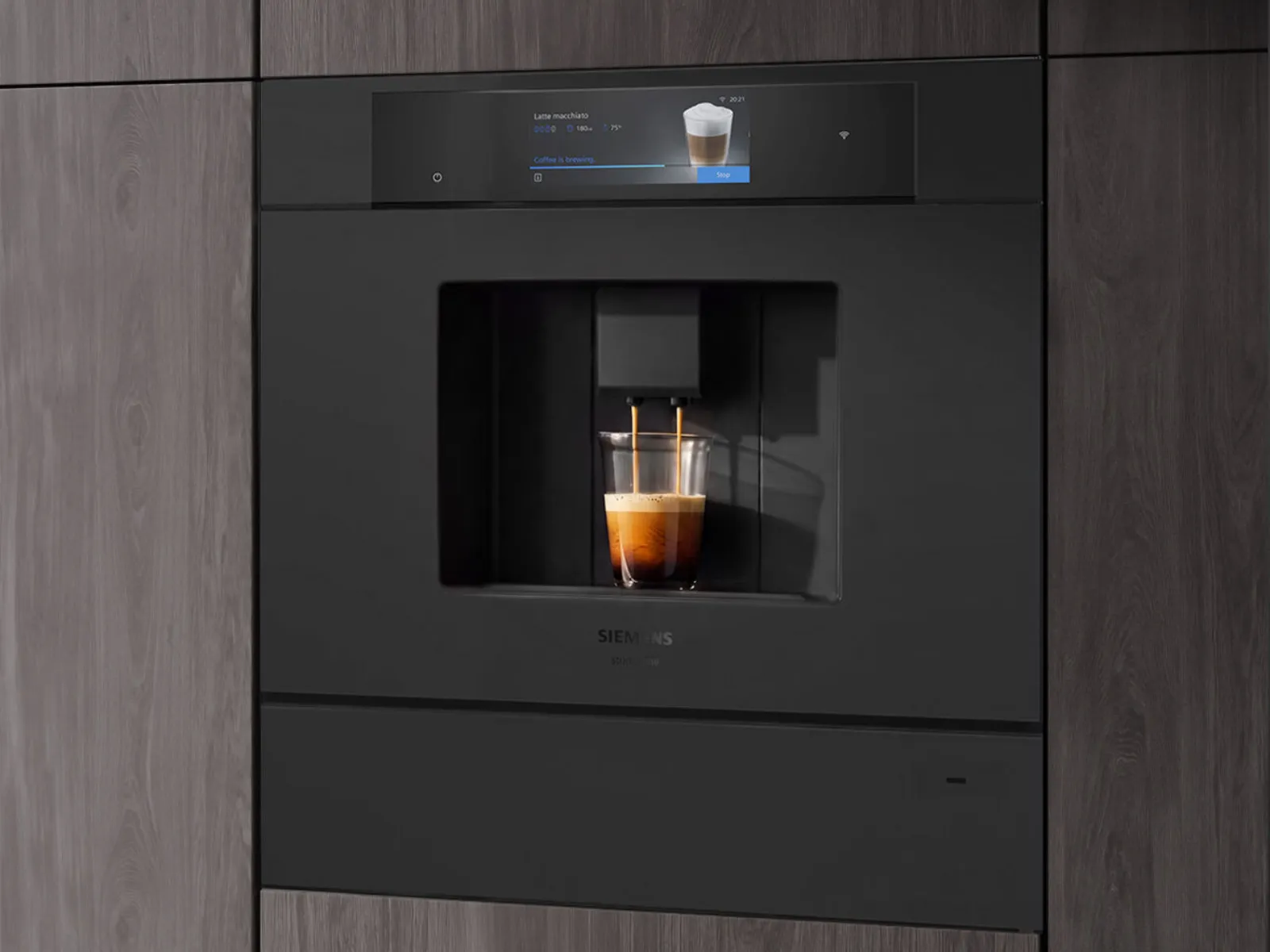 Built-in coffee machine, sleek black and silver design, modern kitchen appliance.