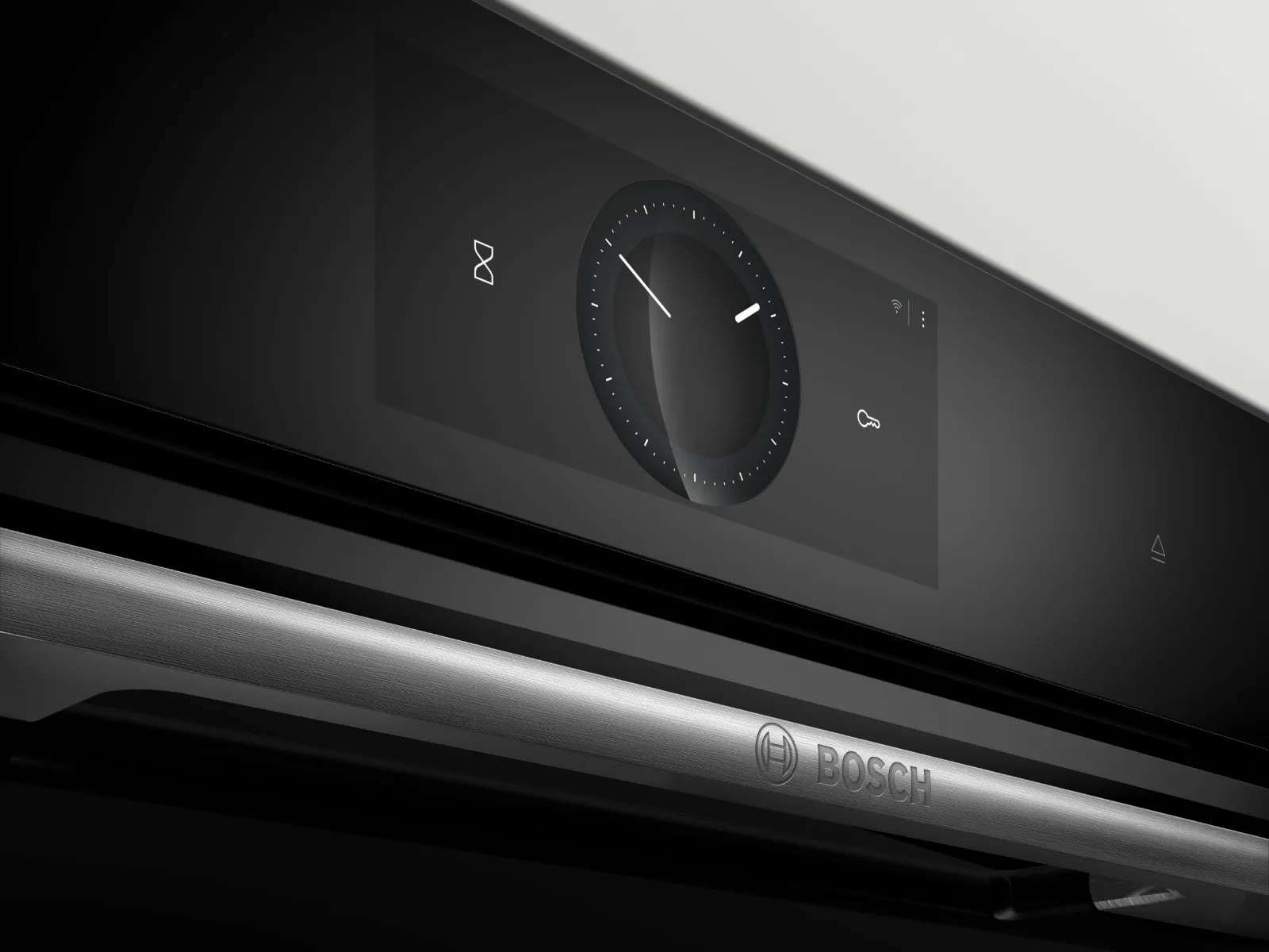 Horno Bosch con controles digitales y puerta abierta, mostrando su exterior de acero inoxidable.