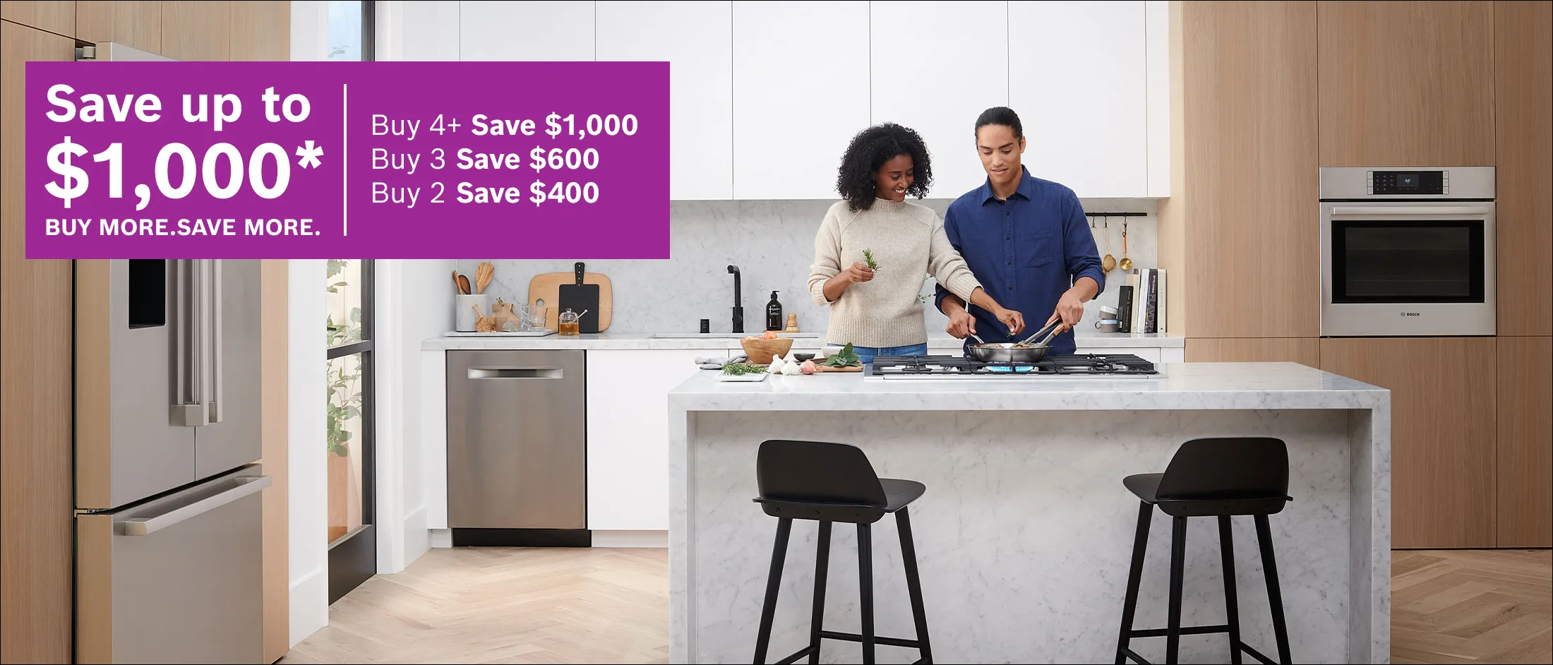Couple cooking in a modern kitchen beside appliances, with a French promotion offering up to $1,000 in savings.