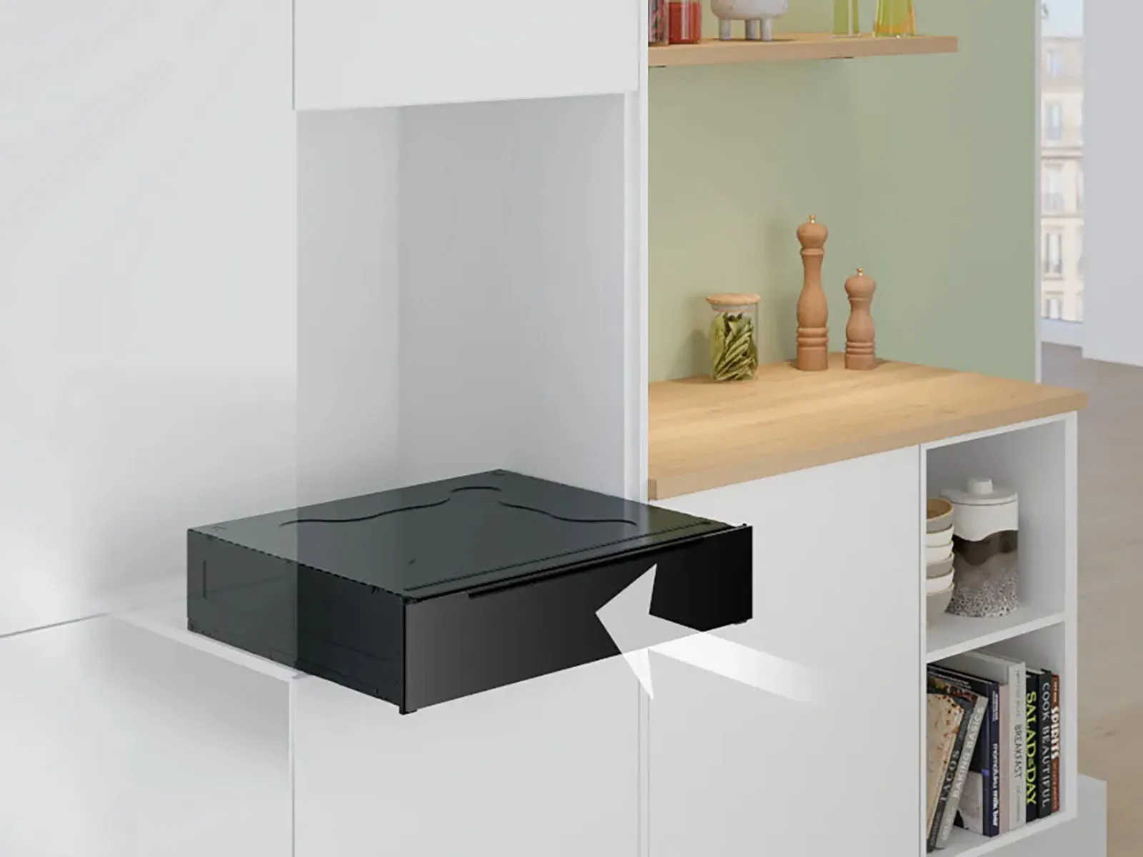 A sleek black kitchen drawer partially extended from modern cabinetry.