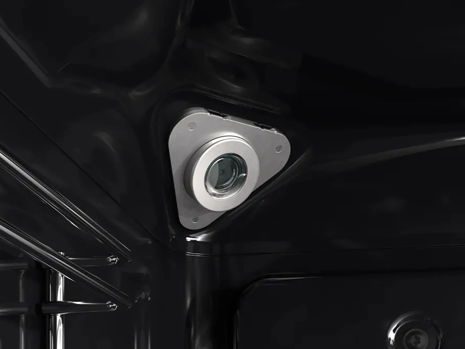 A camera is placed in the corner of an oven interior.