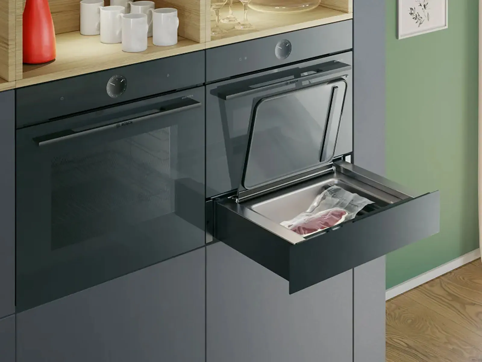 A sous-vide drawer underneath a 45cm oven is opened. a steak which just was vacuumed in a vaccum bag is placed inside the drawer.