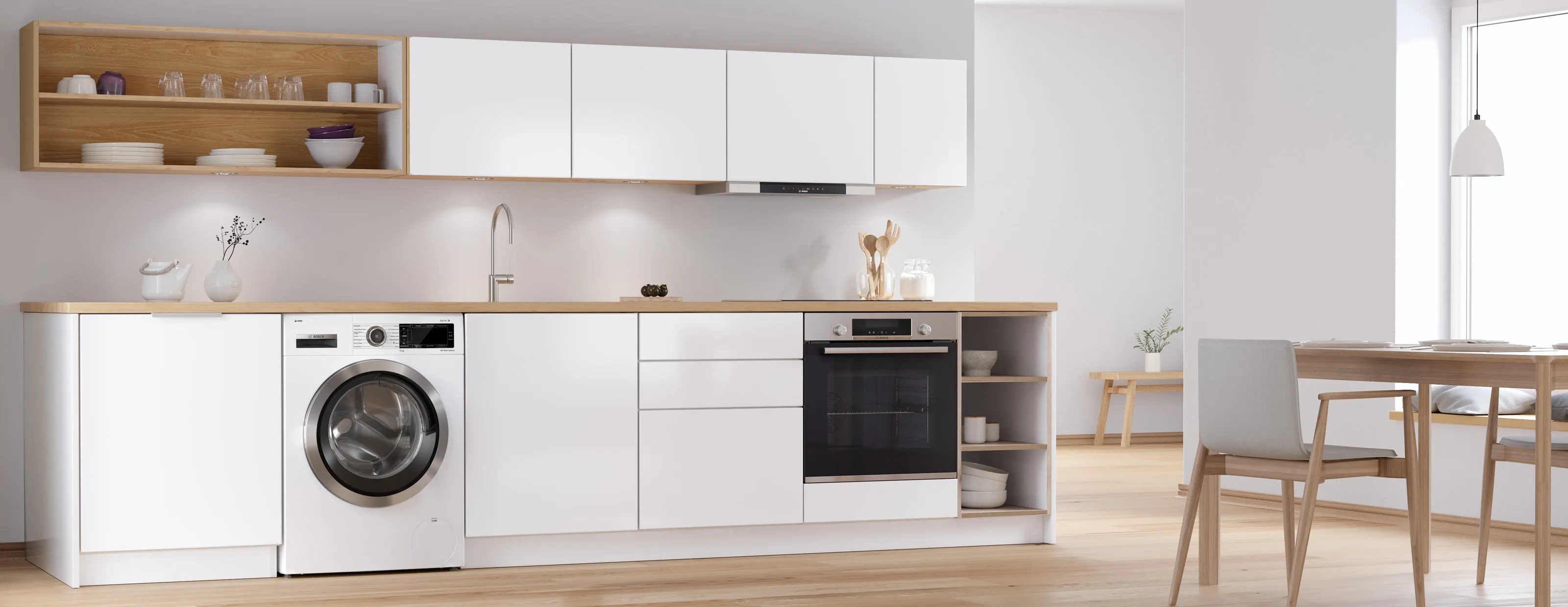Bosch freestanding washer next to condense dryer in a modern room.