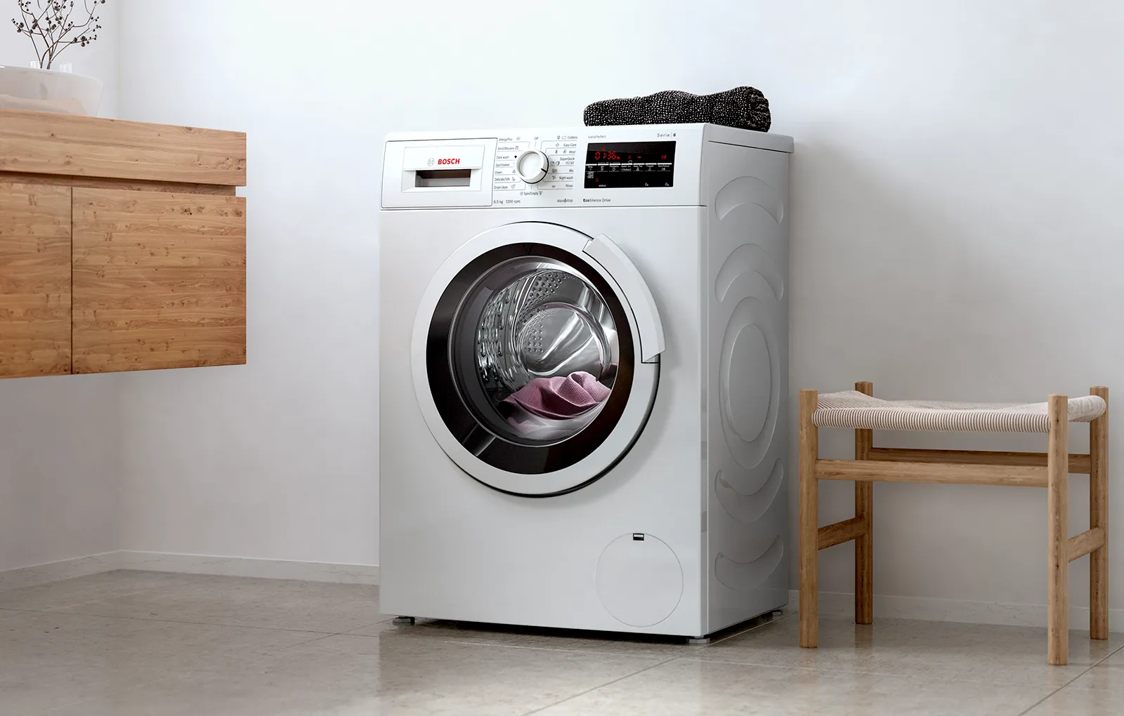 Masina de spalat moderna intr-un interior minimalist.