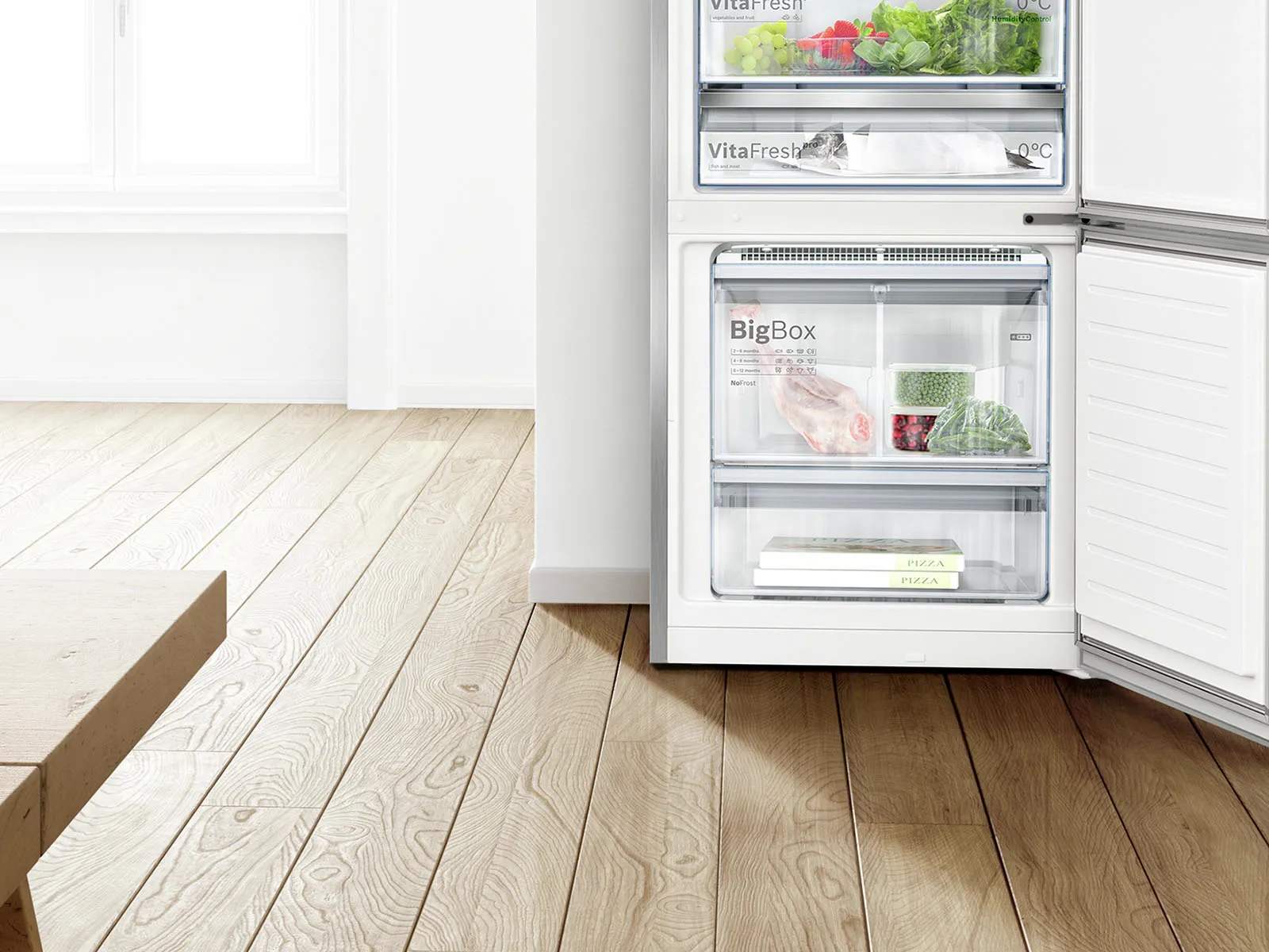 Open refrigerator with fresh produce, wooden floor, and bright interior.