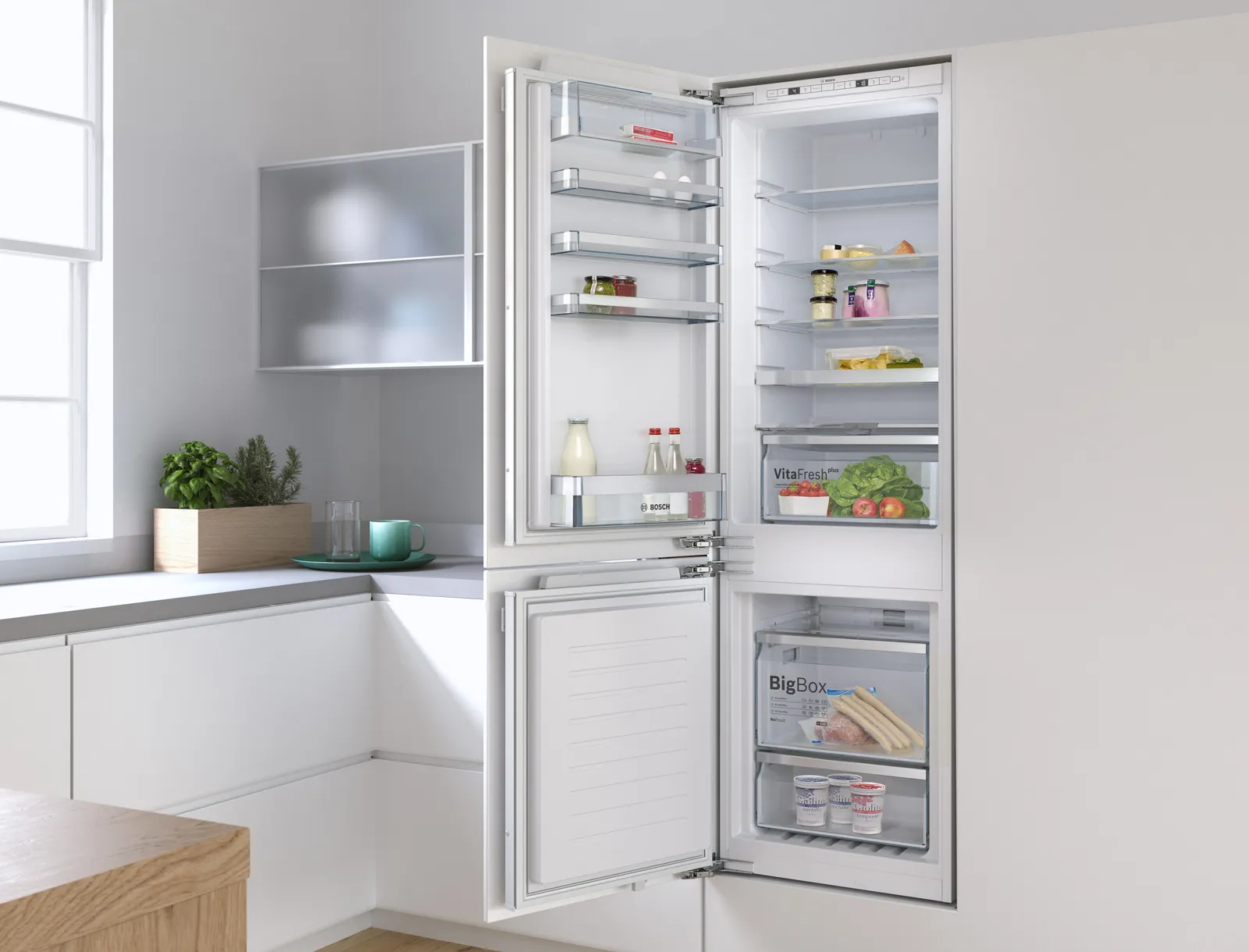 Modern kitchen with open refrigerator displaying various food items and kitchen accessories.