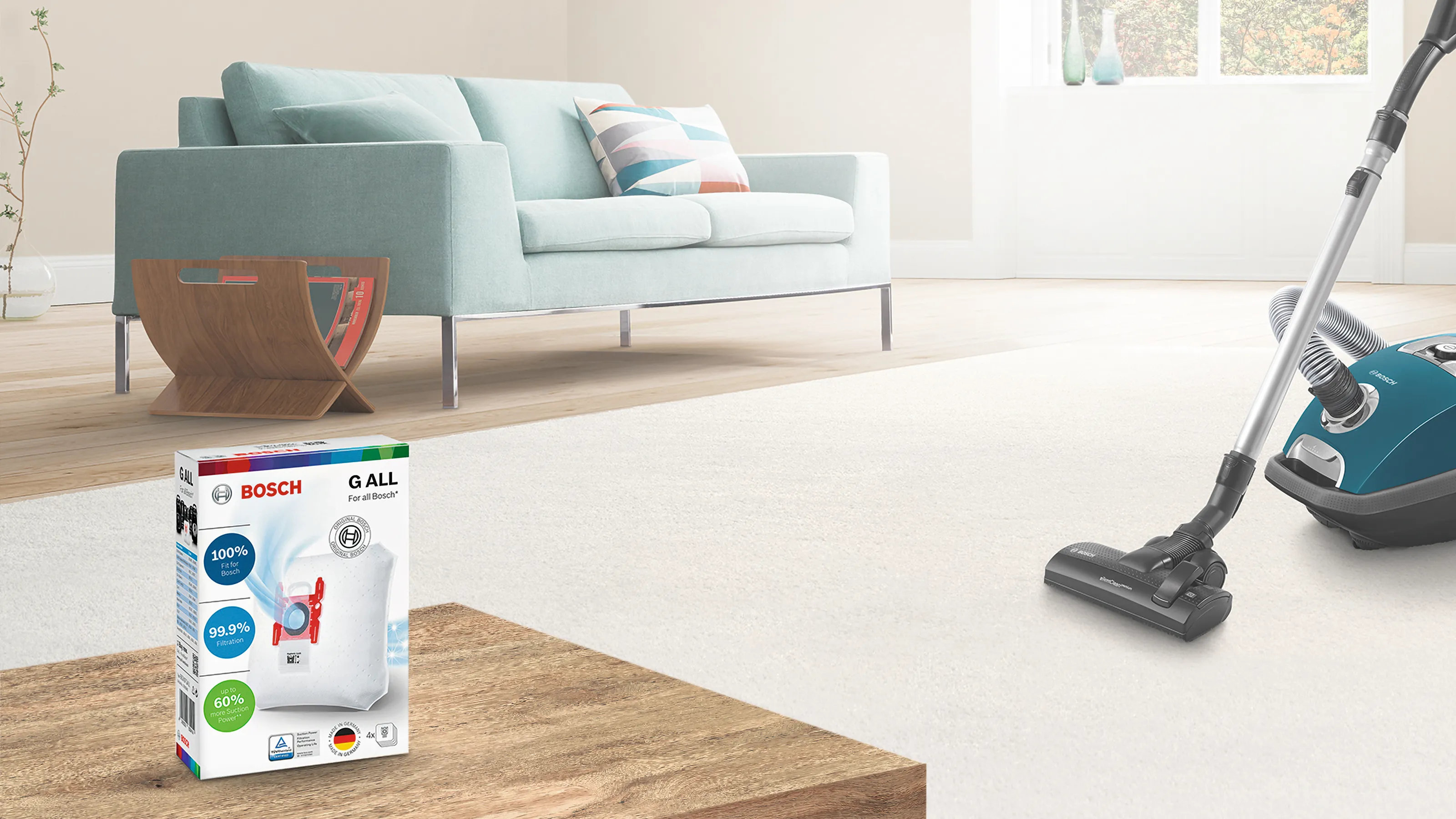 Vacuum cleaner and a dust bag in a living room.