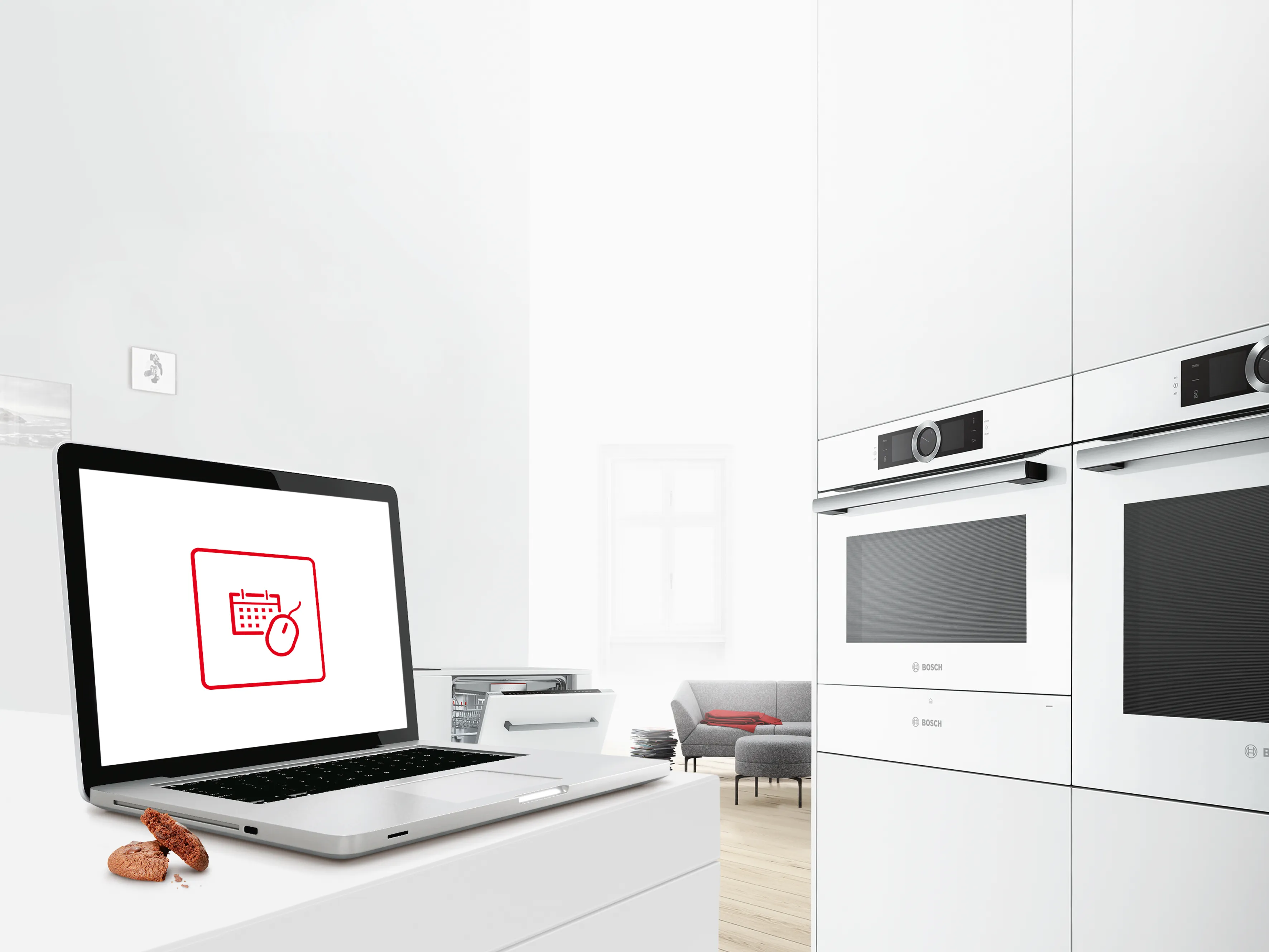 Tablet on a kitchen island with an icon on the screen symbolising the Bosch Online Booking tool.