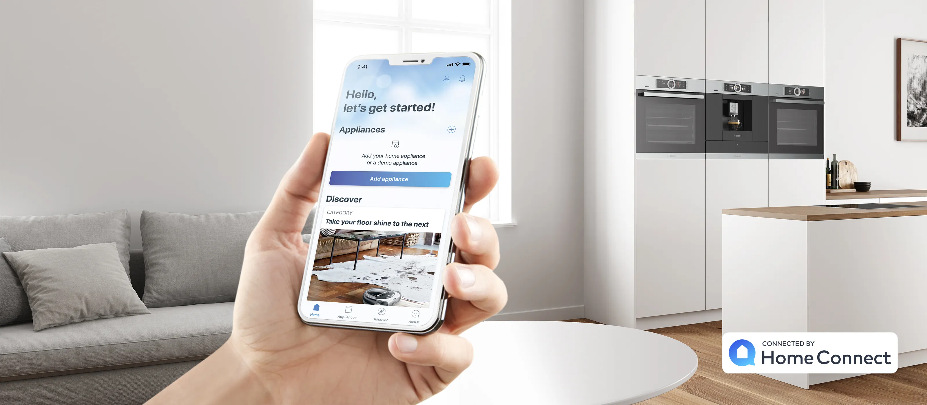 Hand holding smartphone displaying home automation app in modern kitchen interior.