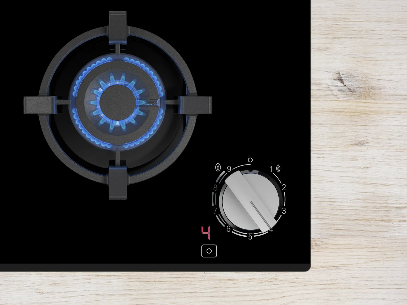 A modern gas stove top with a blue flame on a black surface, featuring a control knob set to level 4.