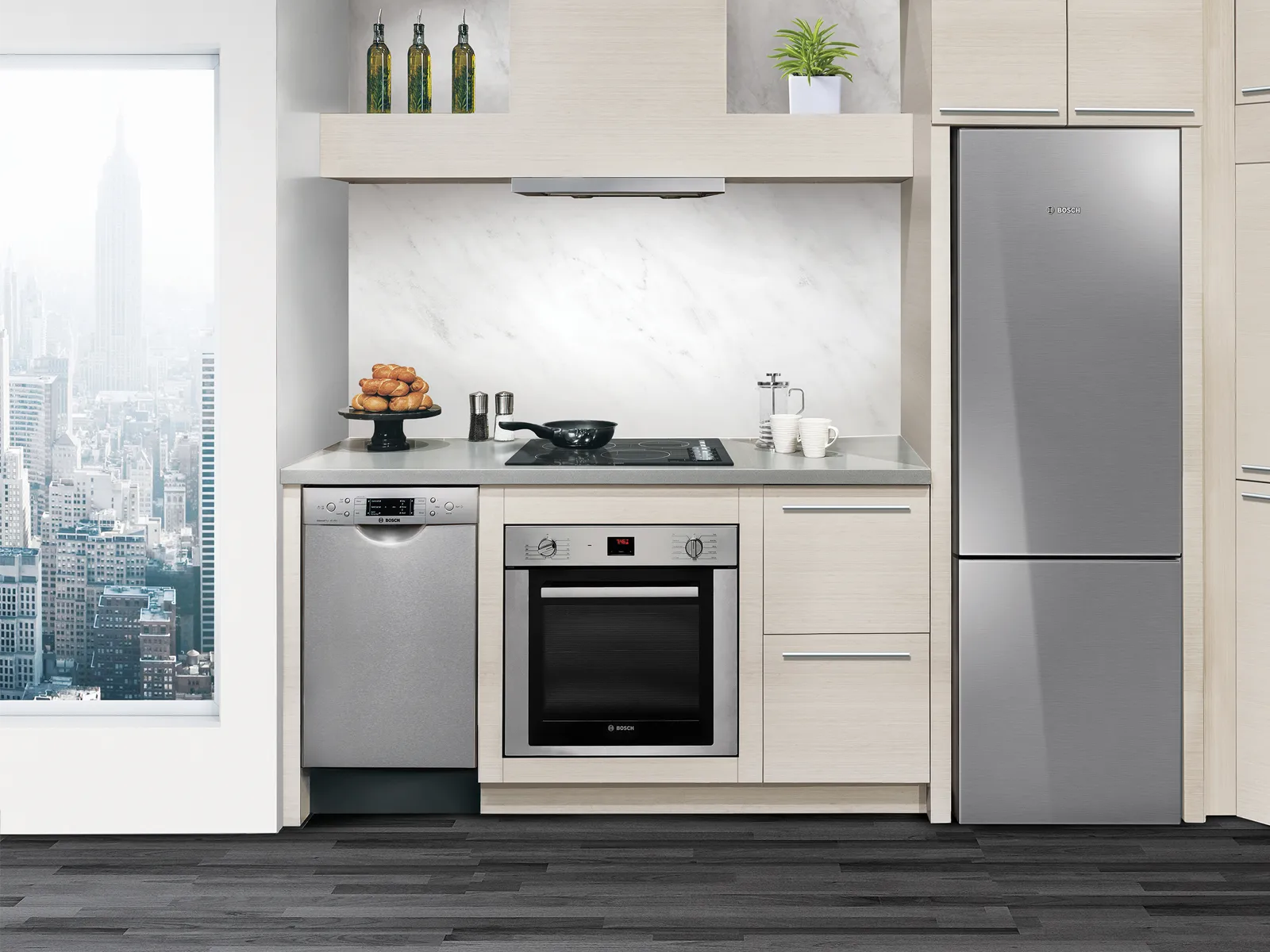 Modern kitchen with Bosch 24 inch refrigerator, Bosch built-in stainless steel appliances and a city skyline view.