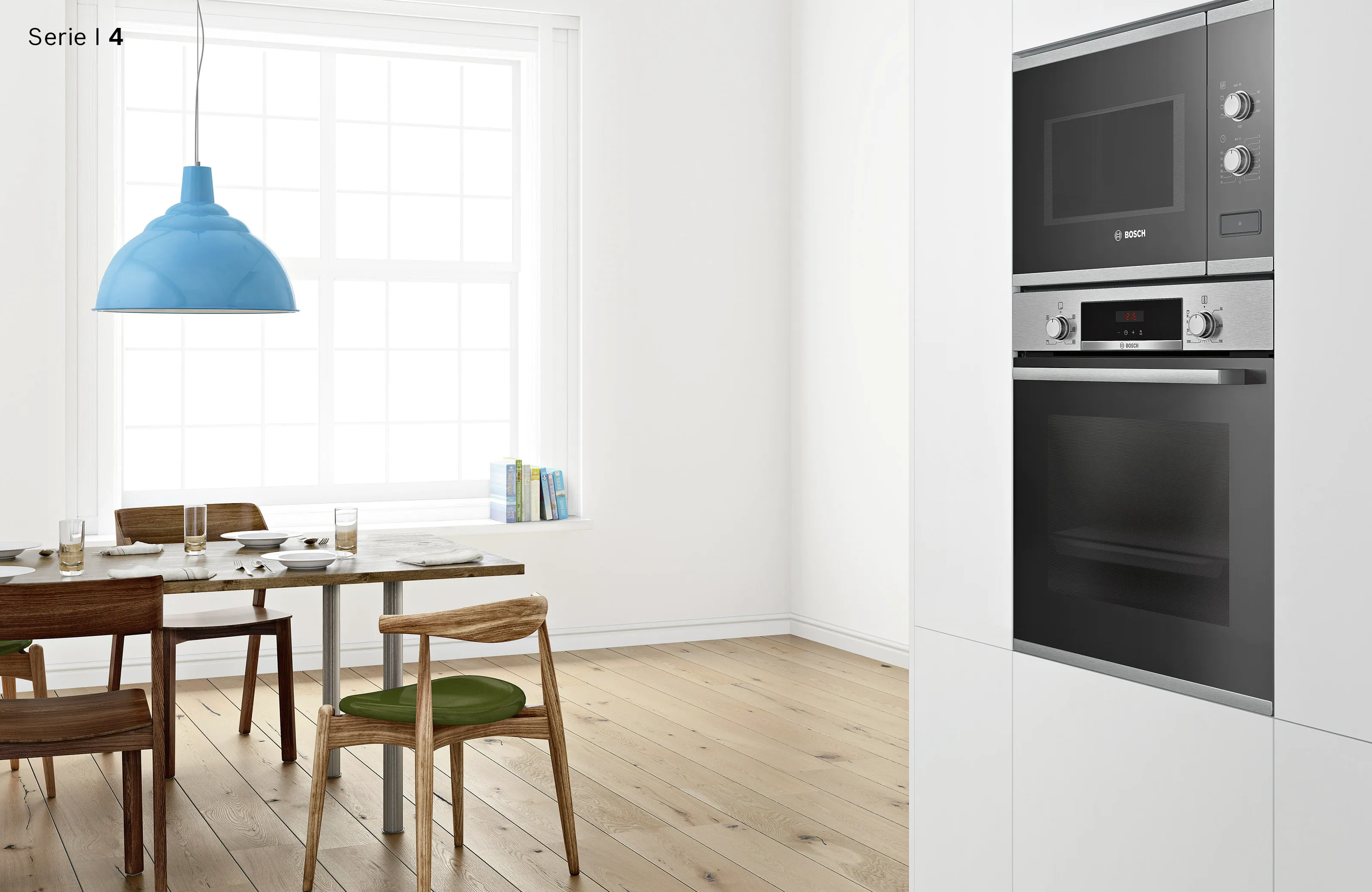 Helle Wohnküche mit eingebautem Bosch Serie 4 Backofen und Mikrowelle sowie einem Holzesstisch unter einer blauen Hängelampe.