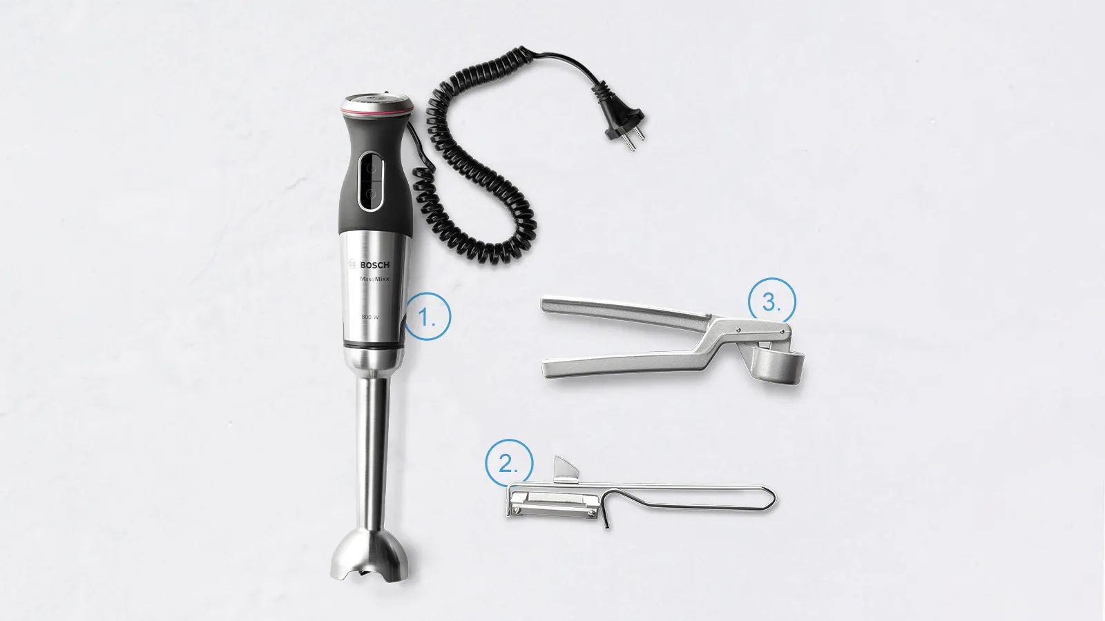 Handheld immersion blender with attachments, peeler and garlic press, on a white background.