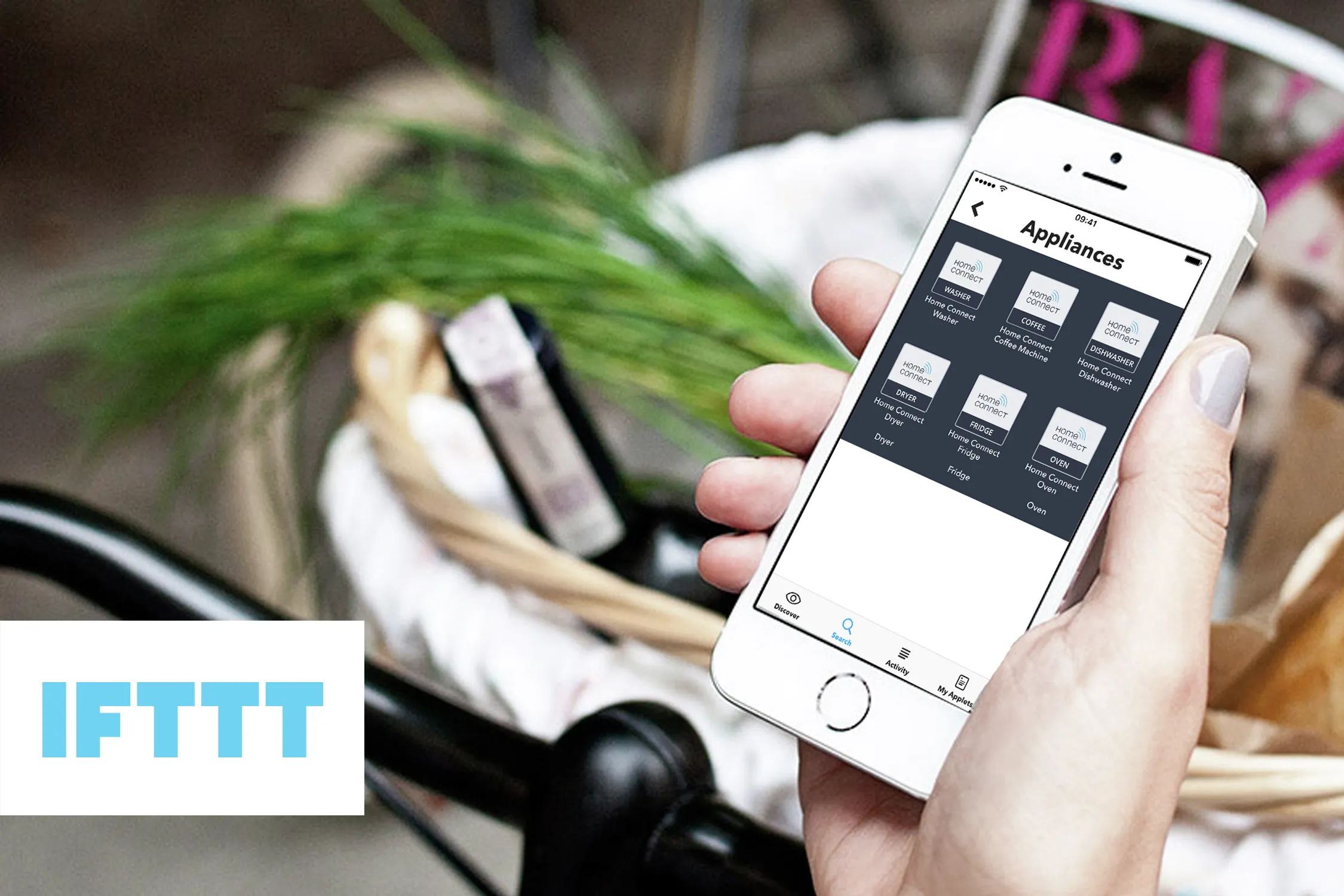 Person using IFTTT app on mobile phone
