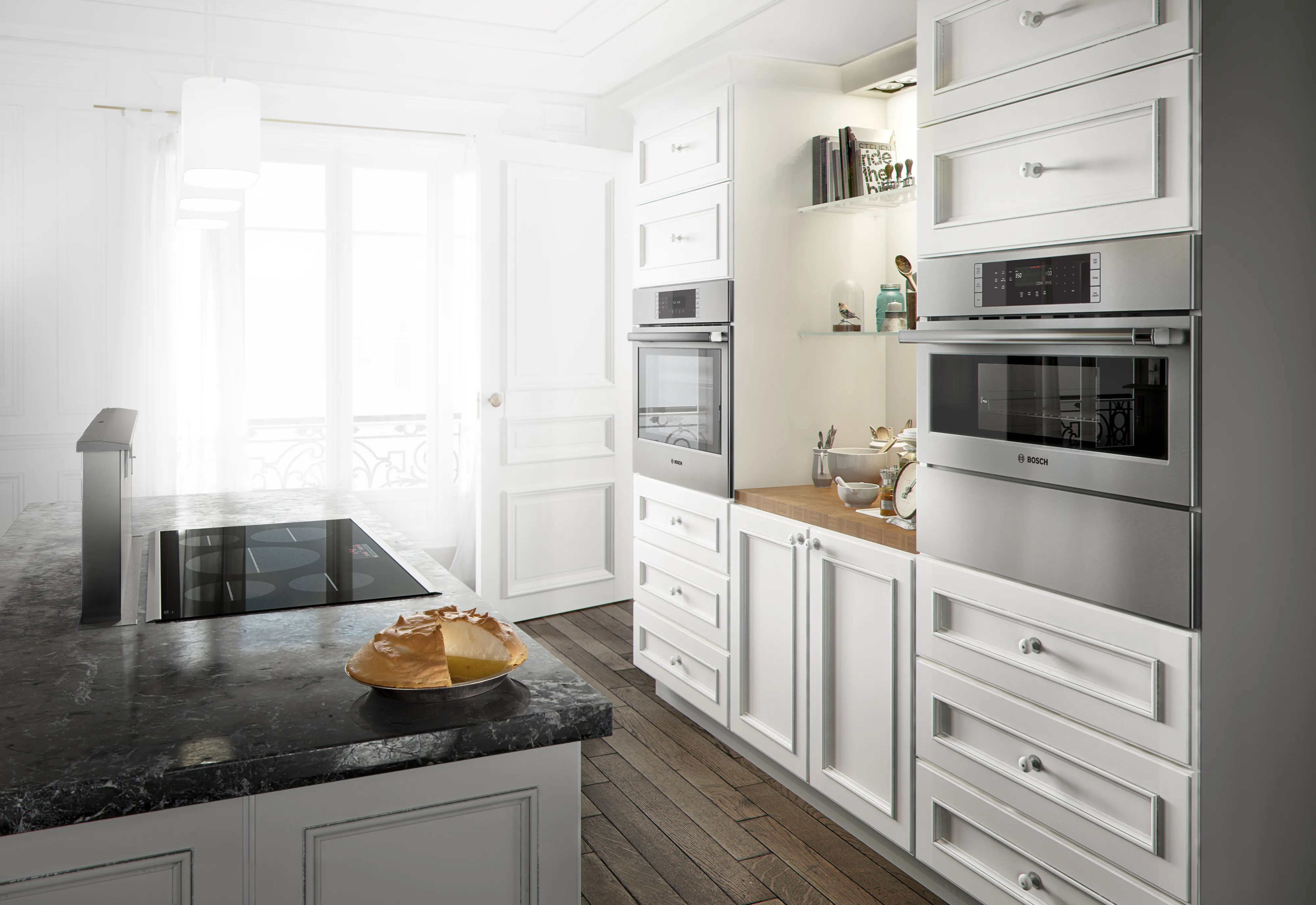 Bosch Microwave Speed oven inside a kitchen with a Bosch Stovetop, black countertop, and Bosch oven in the background