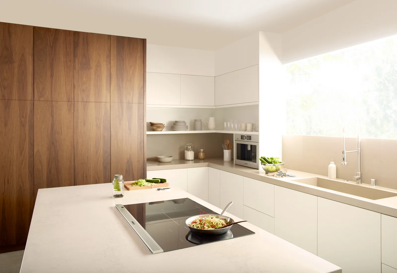 36 inch Induction cooktop with a frying pan cooking on top white countertop 