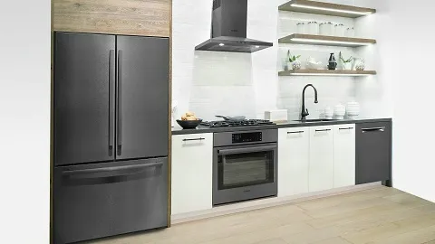 Modern kitchen with Bosch black fridge, oven, and white cabinets, featuring open shelves.