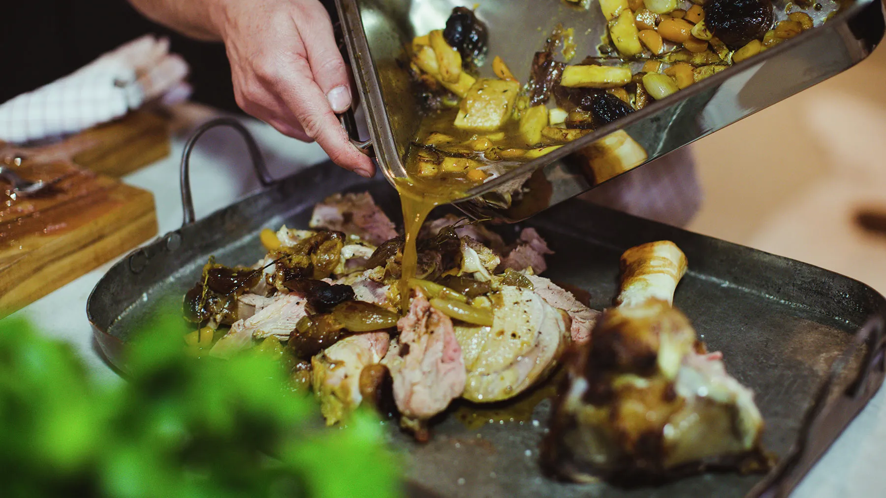 Veal being served with vegetables