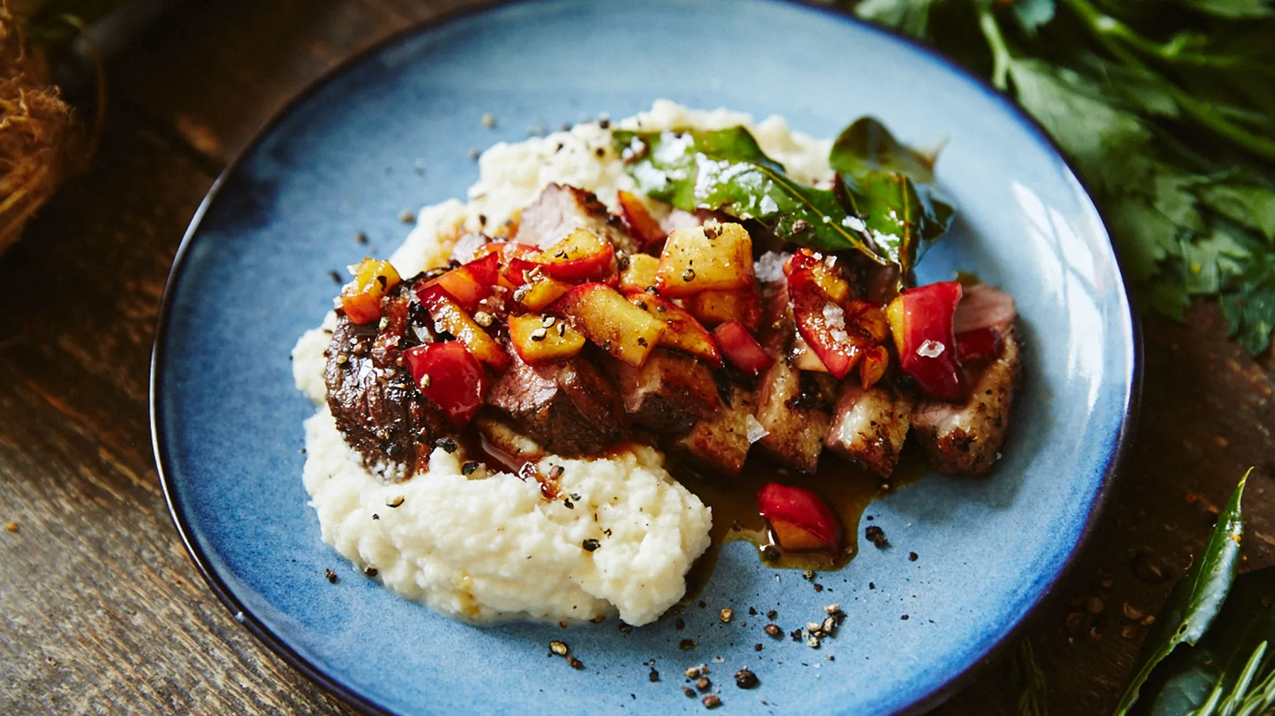 Plate with mashed potatoes, grilled meat, and a colorful vegetable medley.