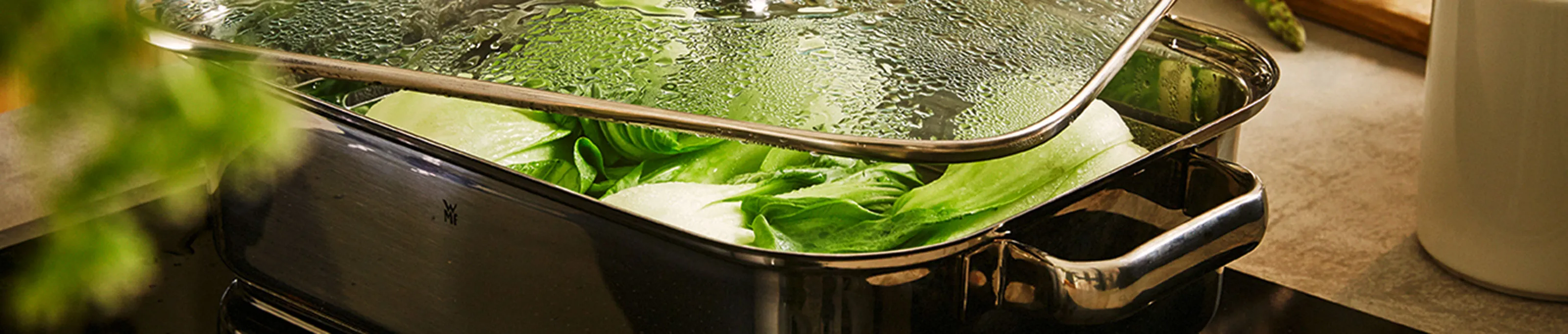 Vegetables in roasting tray with lid on top