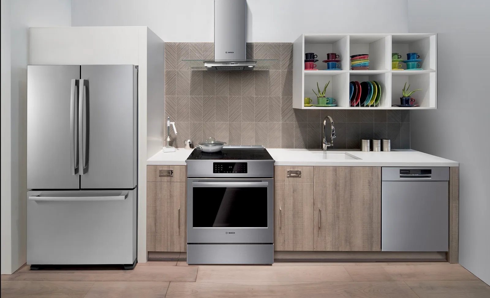 Bosch Freestanding bottom freezer refrigerator inside a Modern kitchen with Bosch appliances, including oven and dishwasher.