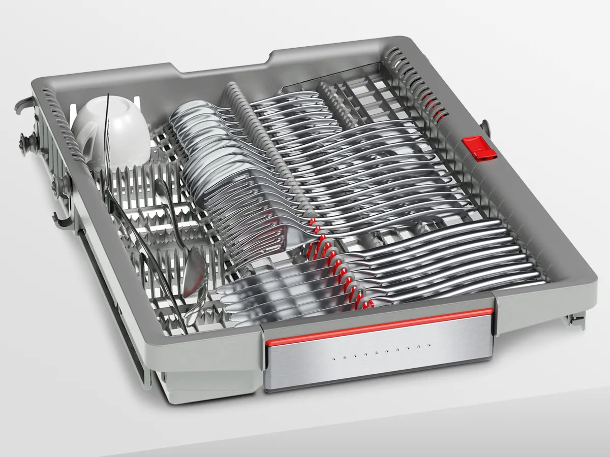 Removable grey dishwasher cutlery tray neatly organized with metal forks, knives, spoons, and small espresso cups.