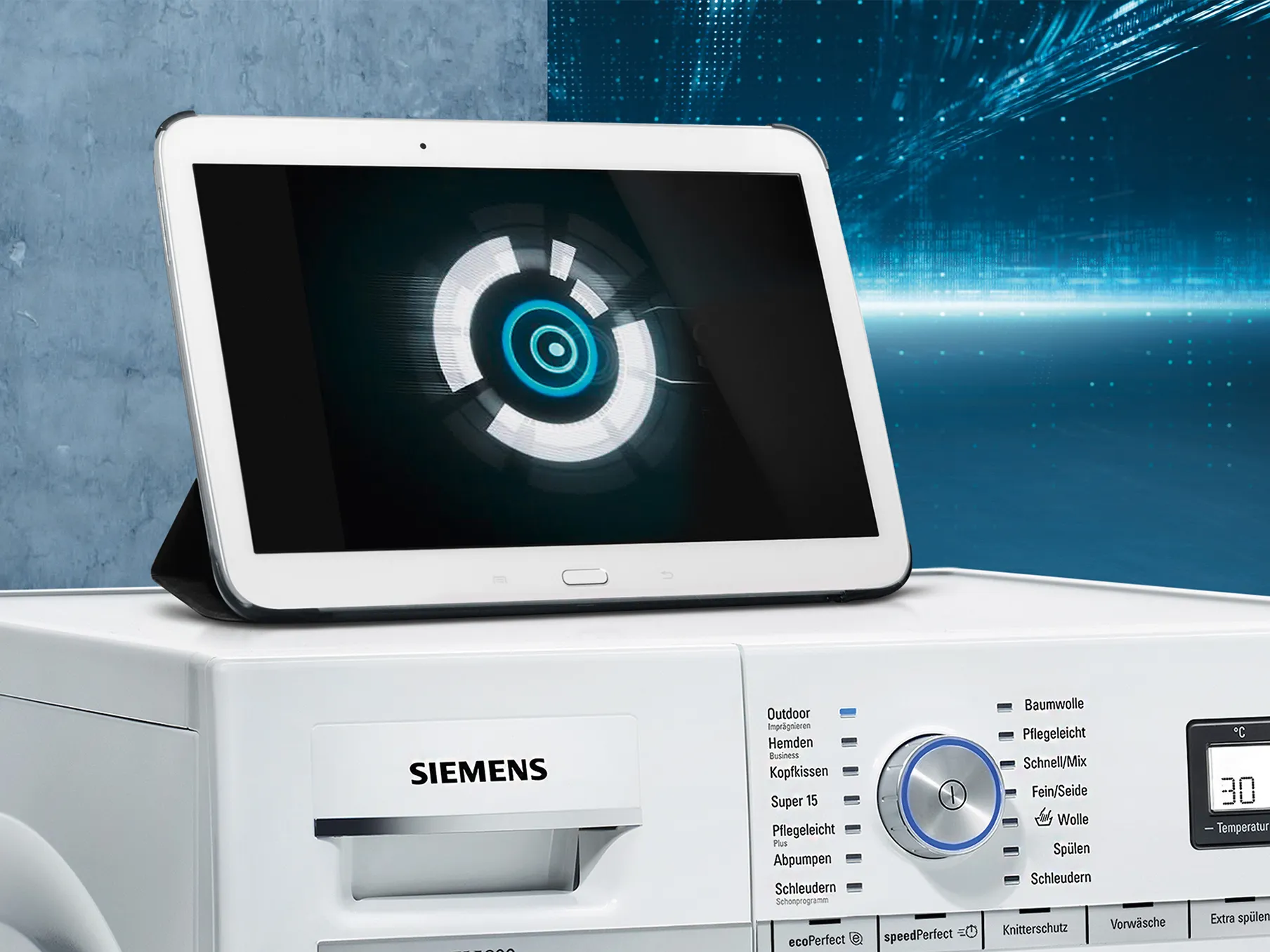 Tablet device displaying a circular loading icon on a dark background, placed on a Siemens appliance.