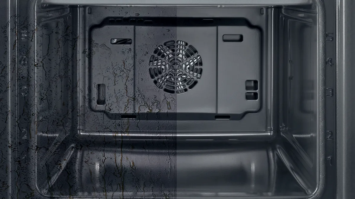 Inside of self cleaning oven with half clean