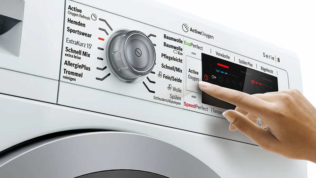 Person using display on washing machine
