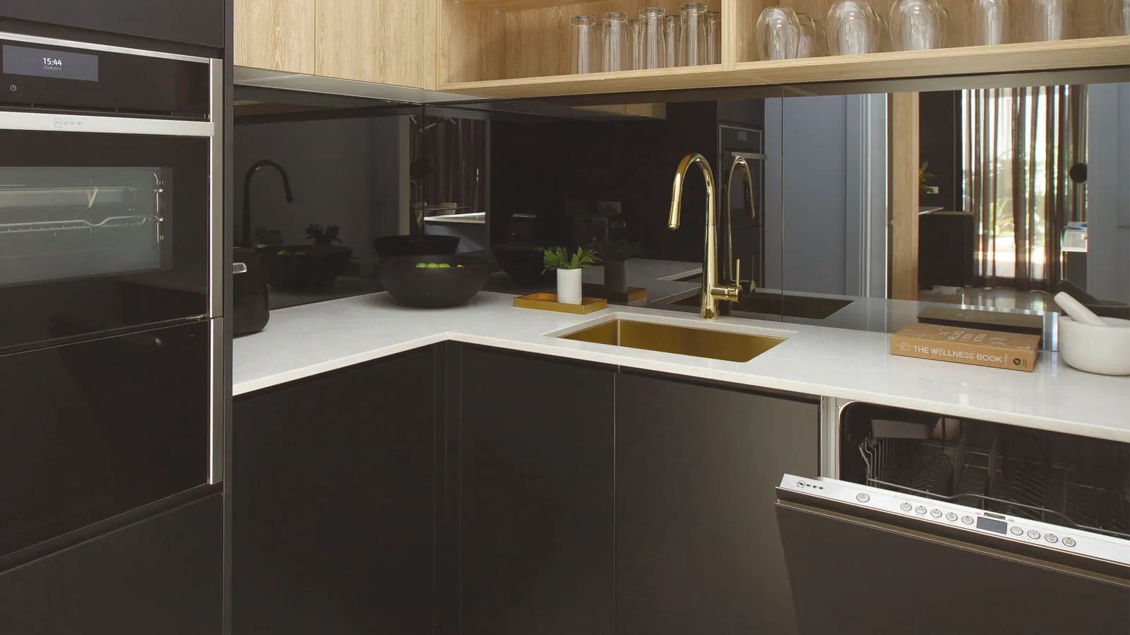 A butlers pantry with three appliances, perfect for preparation.