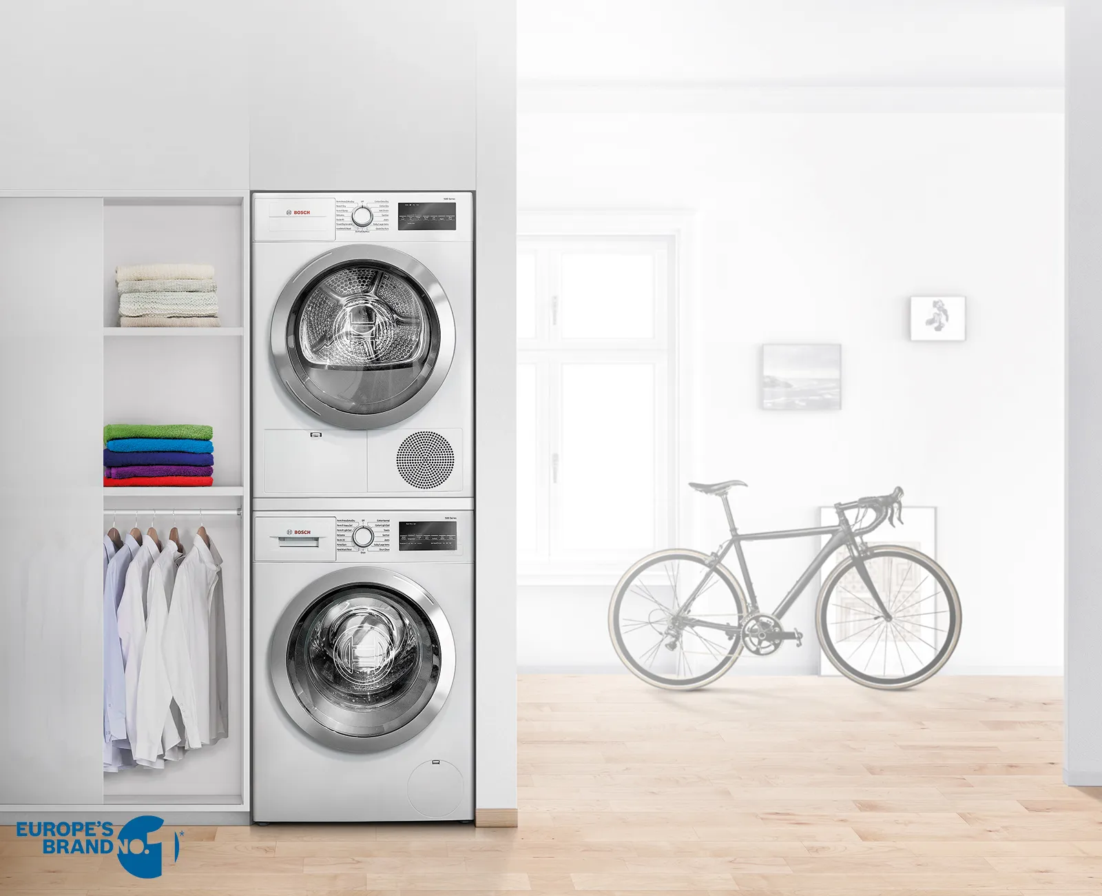Bosch tumble dryers stacked in a laundry room
