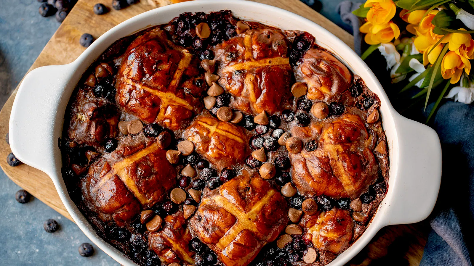 Baked casserole dish with hot cross buns and other ingredients.